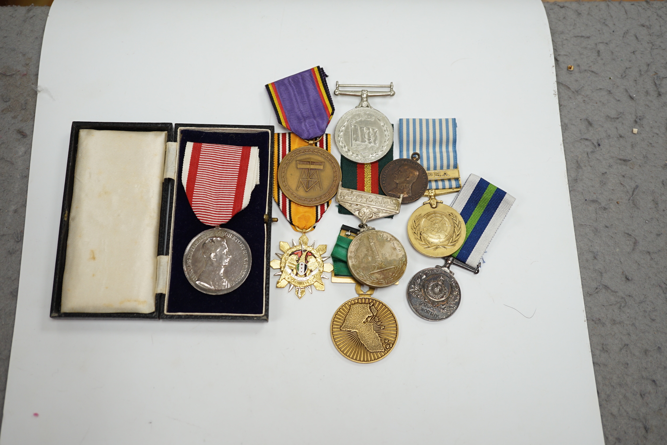 Thirty world military and commemorative medals including; a Belgium War Aid Medal 1914-18, Nigeria Republic Medal, Austri-Hungarian Medal for Bravery, Kuwaiti Liberation Medal, Pakistan Resolution Day Medal, etc.